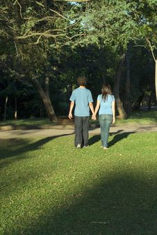 Young Couple Walking Through A Park - Vertical Stock Photography Young Couple Walking Through A Park - Vertical Stock Photography