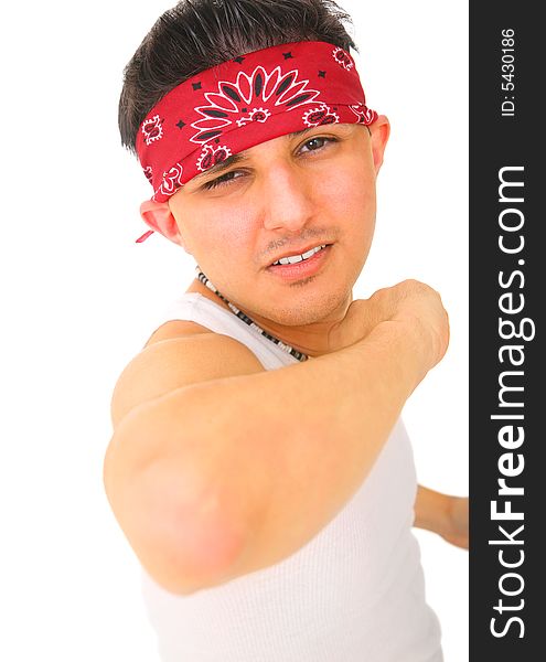 Young man wearing bandana and sleeveless undershirt pointing out his elbow. isolated on white background. Young man wearing bandana and sleeveless undershirt pointing out his elbow. isolated on white background