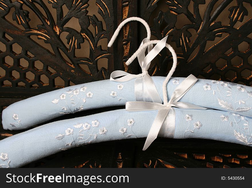 Blue Hangers on a rustic brown background