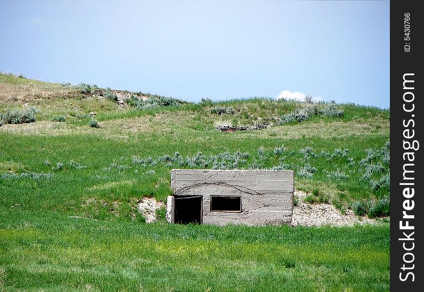A small concrete hideout in the side of a hill. A small concrete hideout in the side of a hill