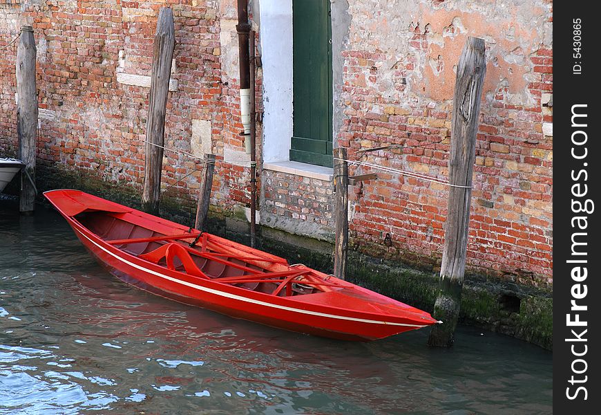 Red boat in Venice, Italy