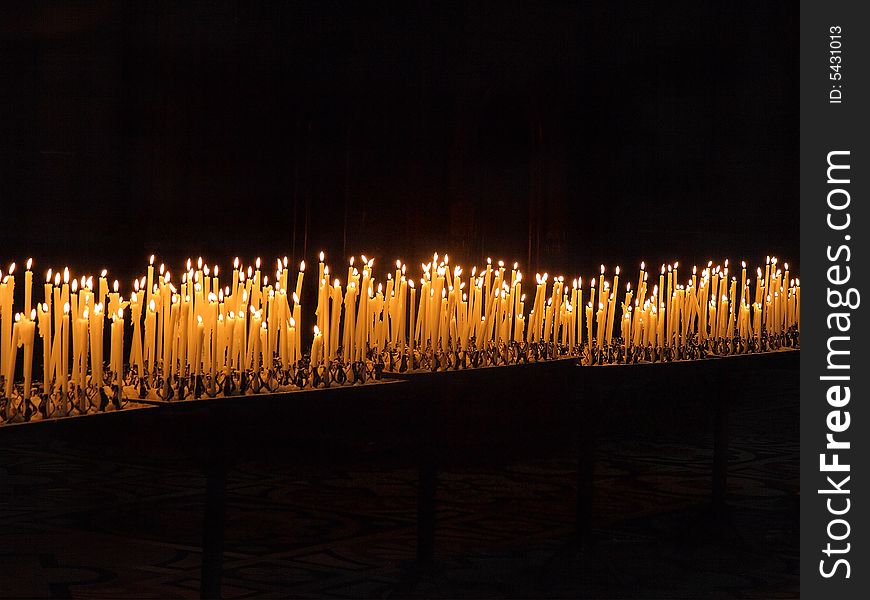 Lighted candles in Milan Cathedral