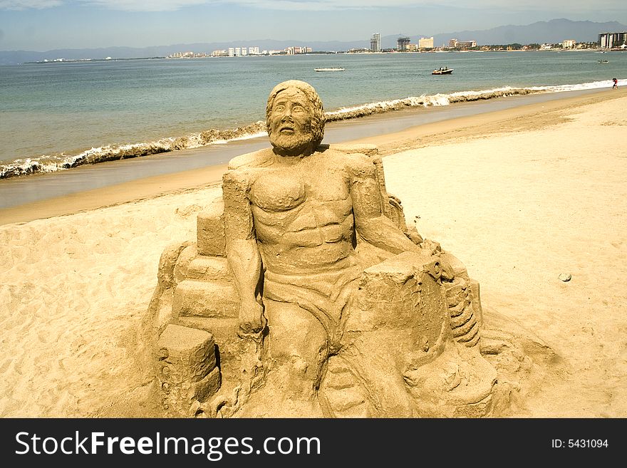 Figures sculpted in sand along the beach at Puerto Vallarta