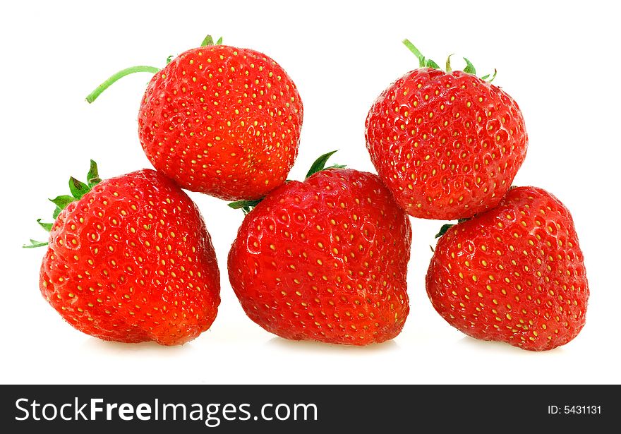 Five fresh strawberries with shadows on a white background