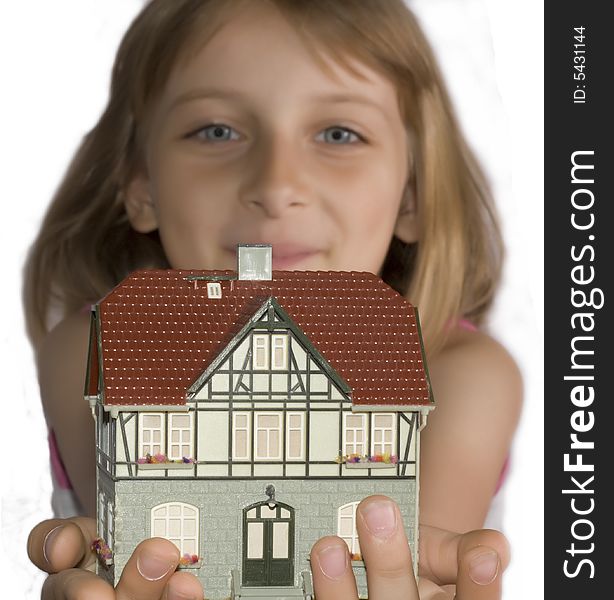 Young beautiful girl with house in hand. Young beautiful girl with house in hand