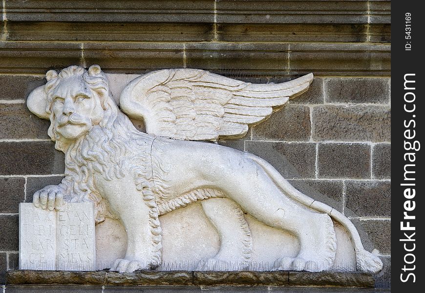 Venetian lion with human face on city gate in Padua, Italy