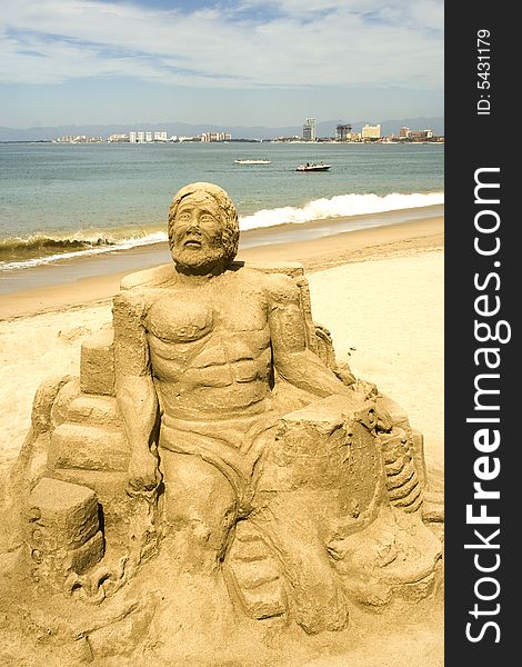 Figures sculpted in sand along the beach at Puerto Vallarta