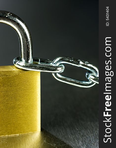 Strong Security Lock & Chain on a metal background. Strong Security Lock & Chain on a metal background