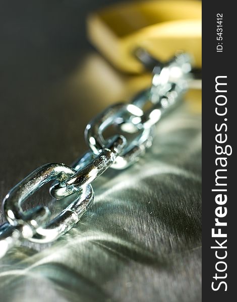 Strong Security Lock & Chain on a metal background. Strong Security Lock & Chain on a metal background