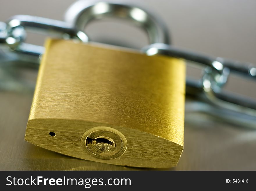 Strong Security Lock & Chain on a metal background. Strong Security Lock & Chain on a metal background