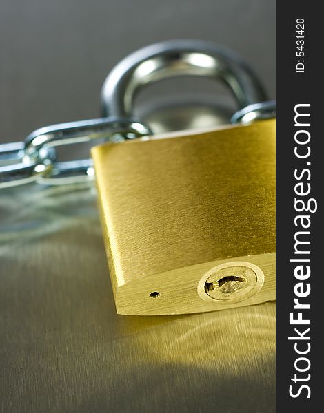 Strong Security Lock & Chain on a metal background. Strong Security Lock & Chain on a metal background