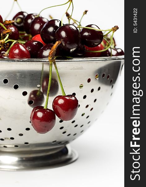 Fresh cherry in Colander on white background. Fresh cherry in Colander on white background