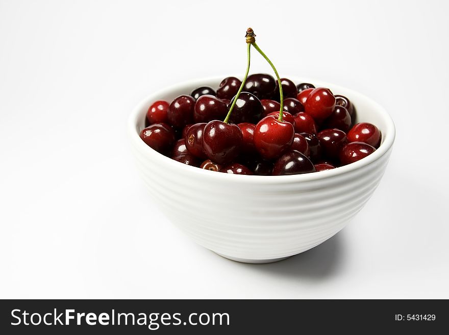 Fresh cherry in white bowl