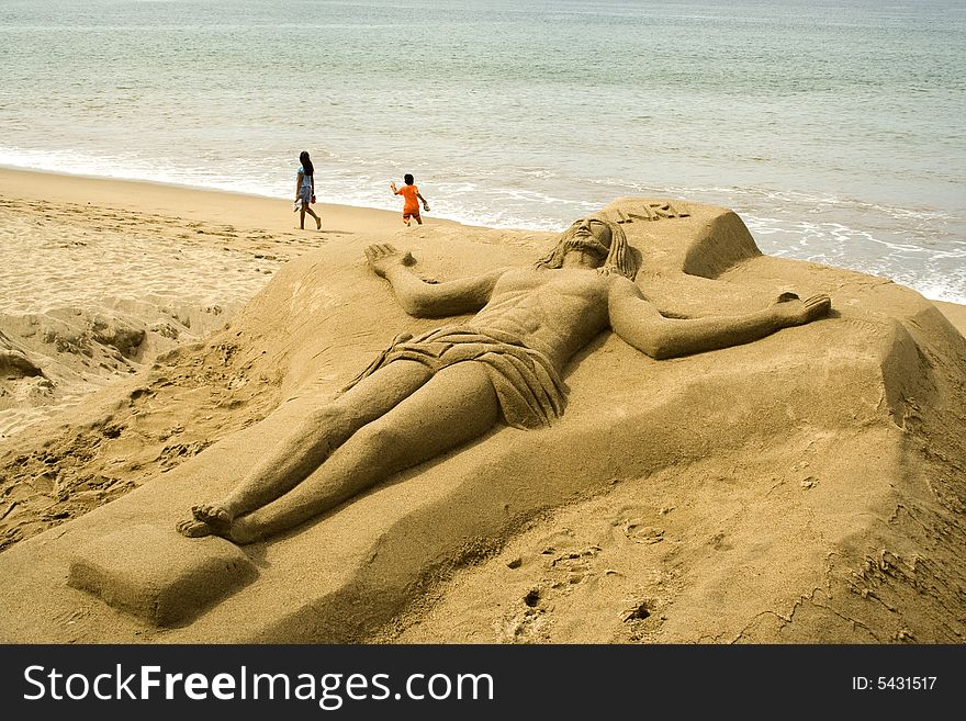 Christ sculpted in sand along the beach at Puerto Vallarta