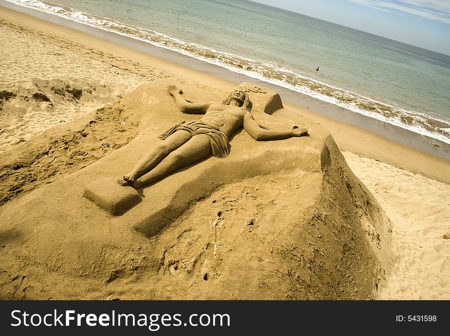 Christ sculpted in sand along the beach at Puerto Vallarta