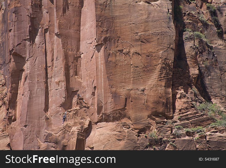 Rock climbers climbing a wall in Zion National Park, Utah. Rock climbers climbing a wall in Zion National Park, Utah.