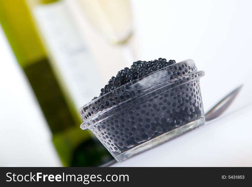 Black caviar with wine close up