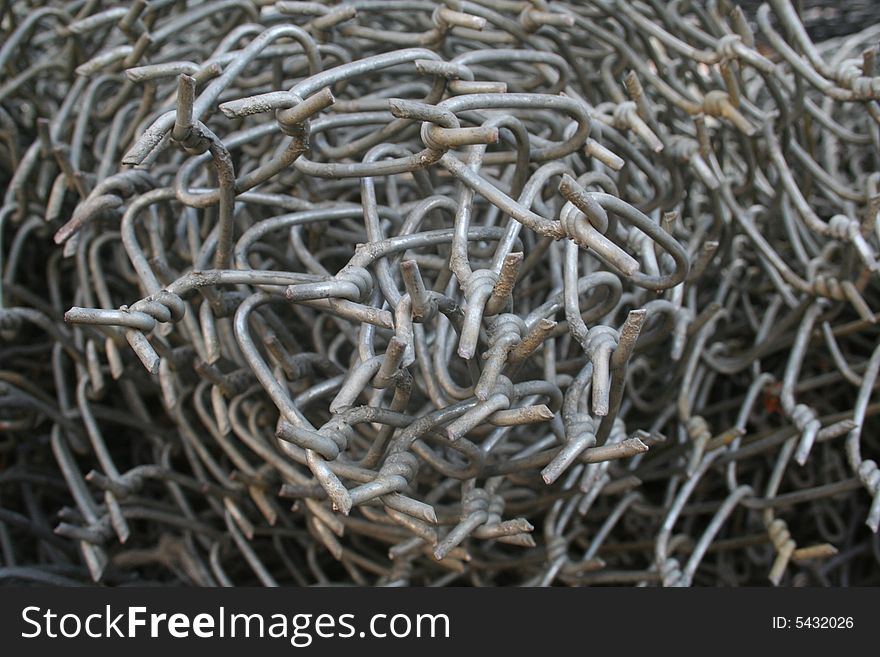 Detail of a roll of metallic chain links. Detail of a roll of metallic chain links.