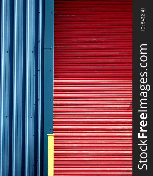 Colourful factory wall door and post in vivid color. Colourful factory wall door and post in vivid color