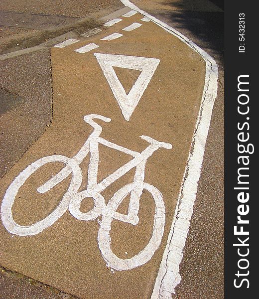Small cycle lane by road junction and crossing