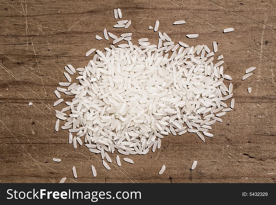 Rice On Wooden Table.