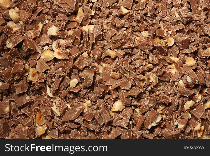 Chopped chocolate with nuts, frame filling, great as background. Chopped chocolate with nuts, frame filling, great as background