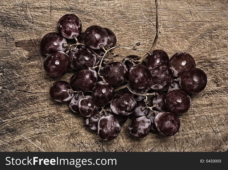 Grapes On Wooden Table.