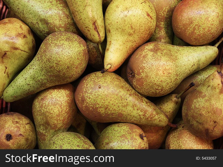 A pile of pears at a farmers market. A pile of pears at a farmers market