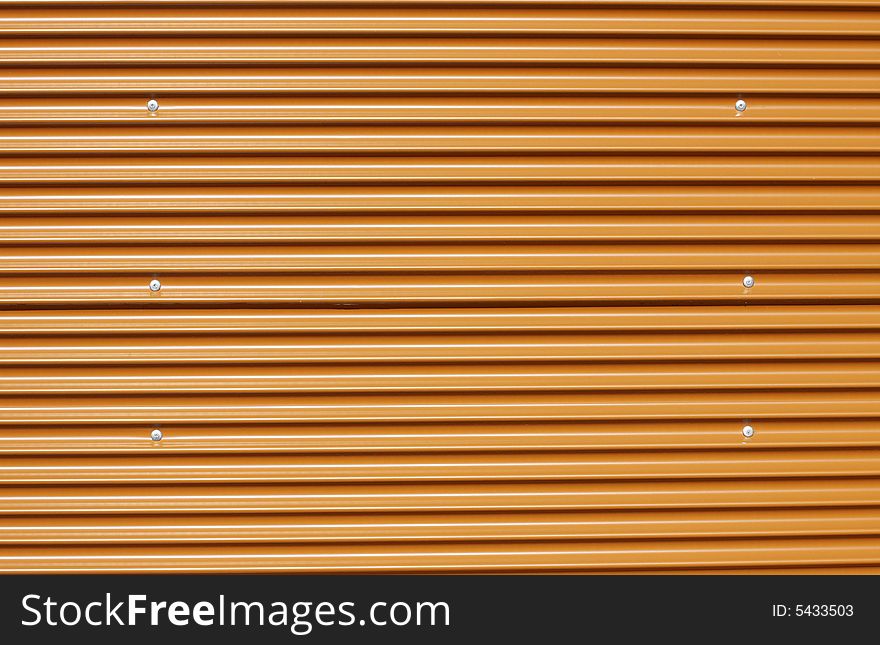 Orange corrugated metal, perfect for designs or backgrounds. Orange corrugated metal, perfect for designs or backgrounds