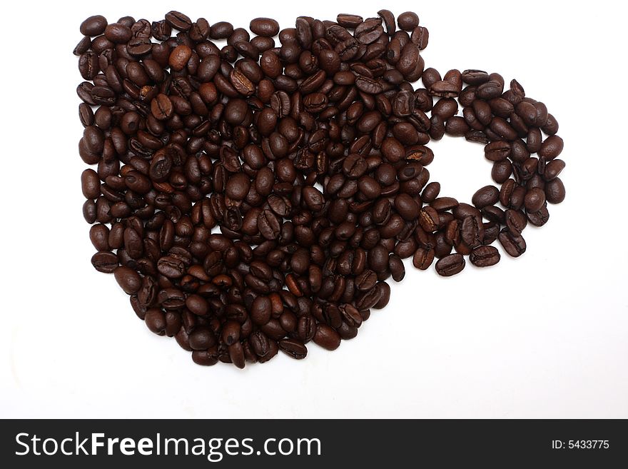 Coffeebeans arranged in the shape of a cup, isolated on white. Coffeebeans arranged in the shape of a cup, isolated on white