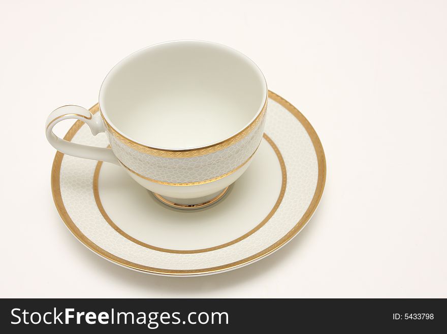 A top view shot of an empty cup of coffee isolated on white