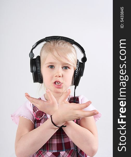 Small girl listening to music on headset. Small girl listening to music on headset