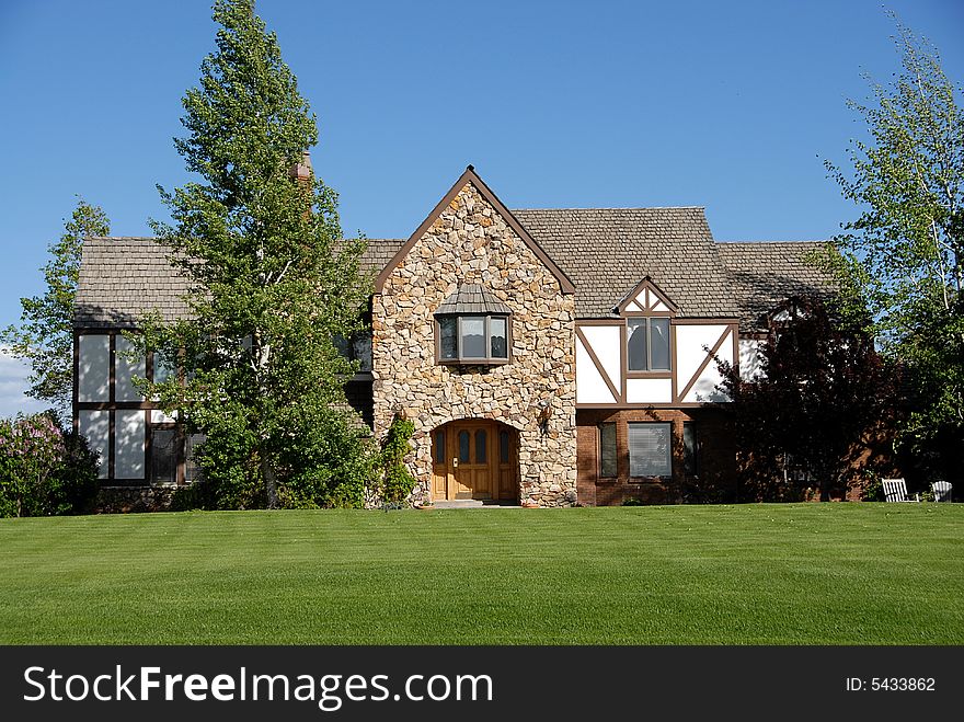 350,000 family home made of brick, with a blue sky and landscape yard. 350,000 family home made of brick, with a blue sky and landscape yard