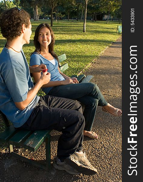 Young Couple on a Park Bench - Vertical