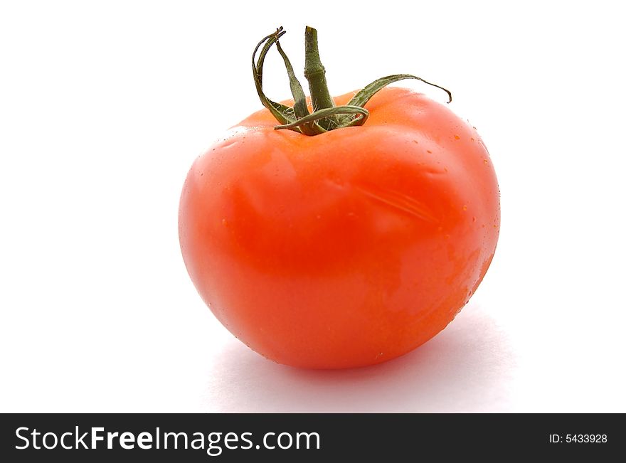 A photograph of a tomato against a white background