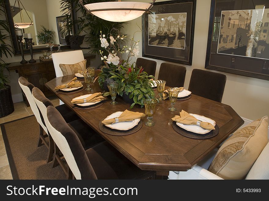 Luxury home dining table with exquisite tableware. Luxury home dining table with exquisite tableware.