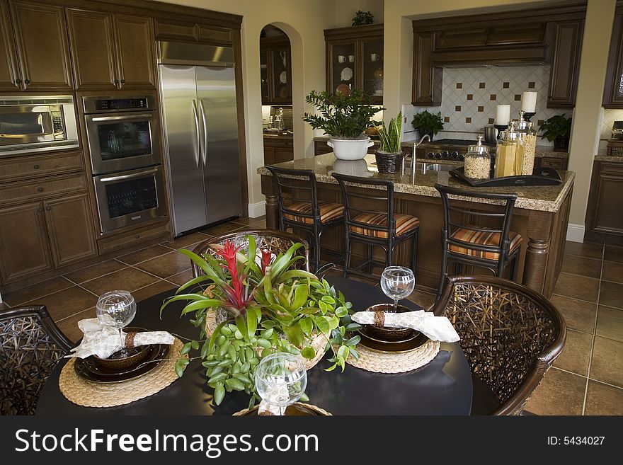 Decorated table with kitchen in the background. Decorated table with kitchen in the background.