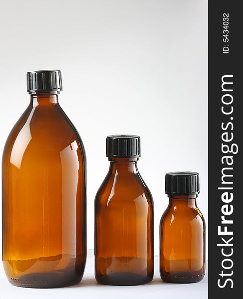 Three brown medicine bottles shot in studio.