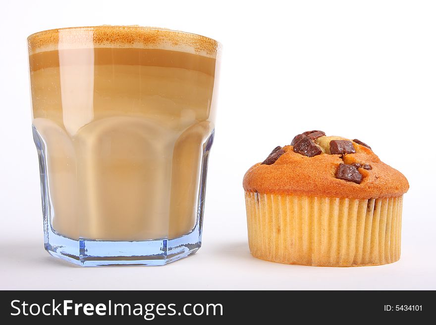 Cafe aulait in a glass with chocolate muffin, isolated on white. Cafe aulait in a glass with chocolate muffin, isolated on white