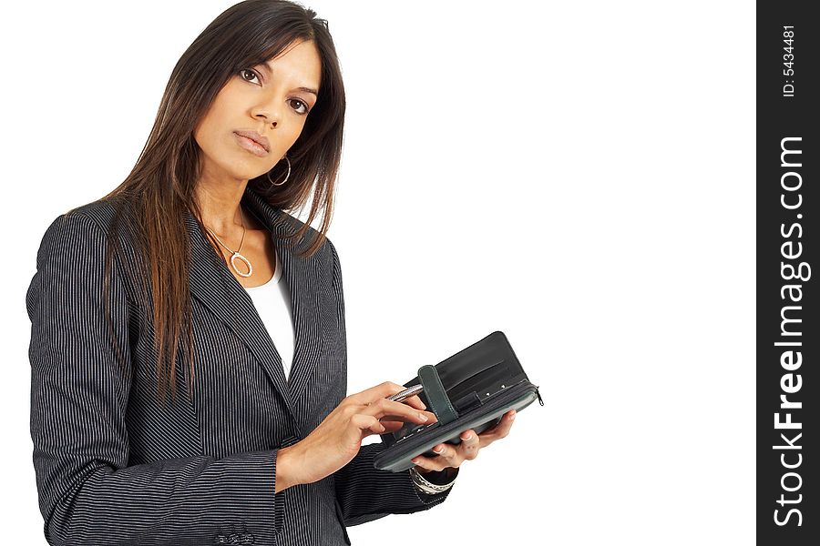 Beautiful brunette woman in pinstripe suit holding her diary and pen. Isolated on white background with copy space. Beautiful brunette woman in pinstripe suit holding her diary and pen. Isolated on white background with copy space