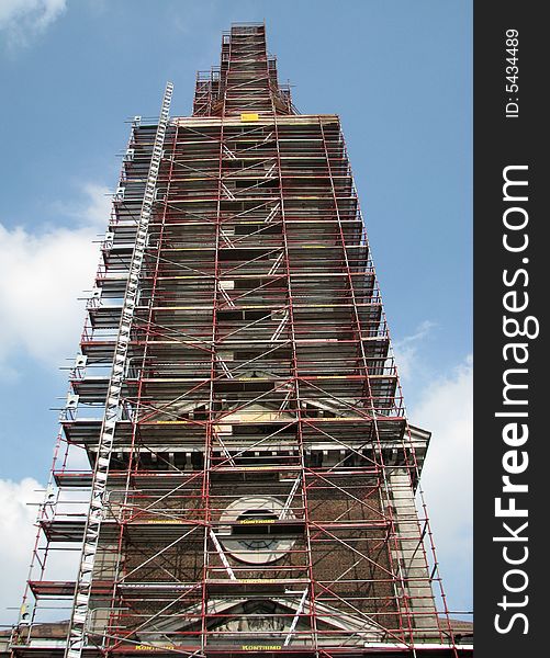 Metal frame around a church tower for restoration. Metal frame around a church tower for restoration