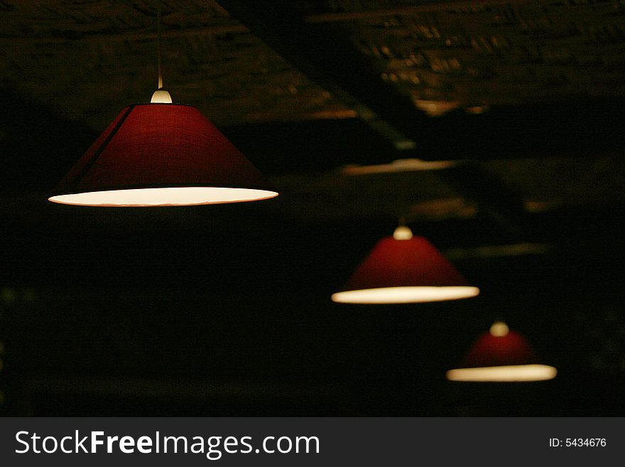 Open roof red lamps in a restaurant. Open roof red lamps in a restaurant