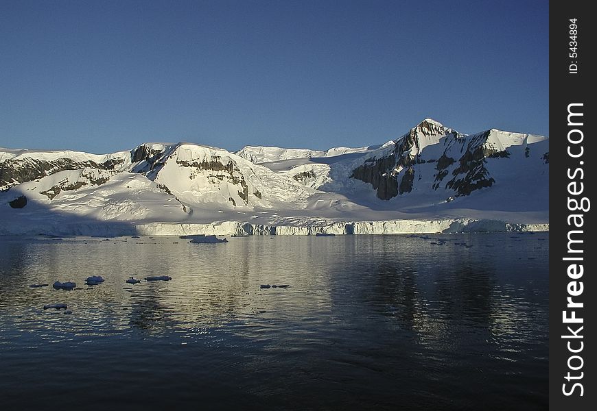 View from the sailing ship Europa on a mountain range in Antarctica. View from the sailing ship Europa on a mountain range in Antarctica