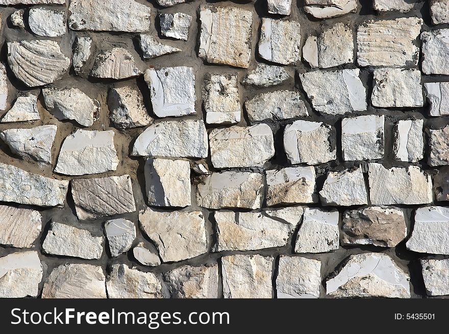 Fragment of a wall from blocks of white limestone. Fragment of a wall from blocks of white limestone