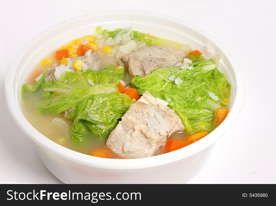 Pork soup with cabbage, corn and carrot