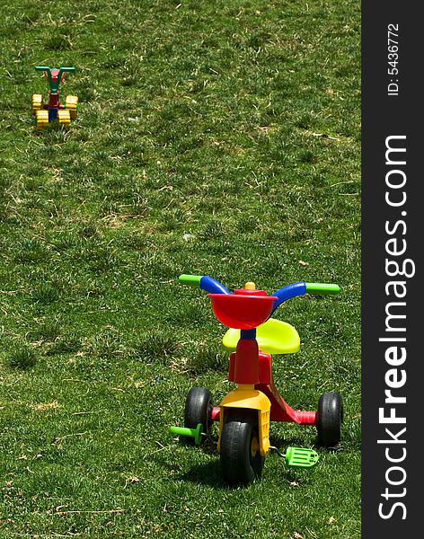Two kid toys on summer grass. Two kid toys on summer grass