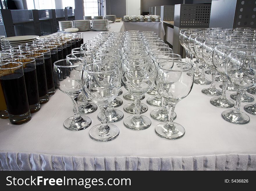 Empty wine glasses and full glasses of fruit juice. Empty wine glasses and full glasses of fruit juice