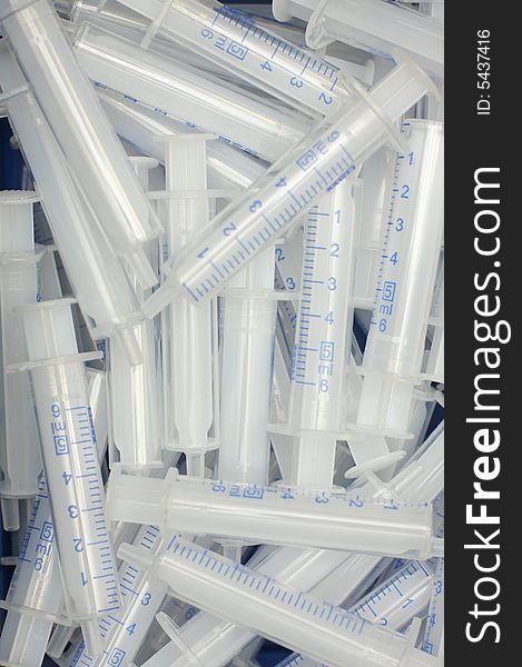 Hospital syringes in a pile, great for health backgrounds. Hospital syringes in a pile, great for health backgrounds