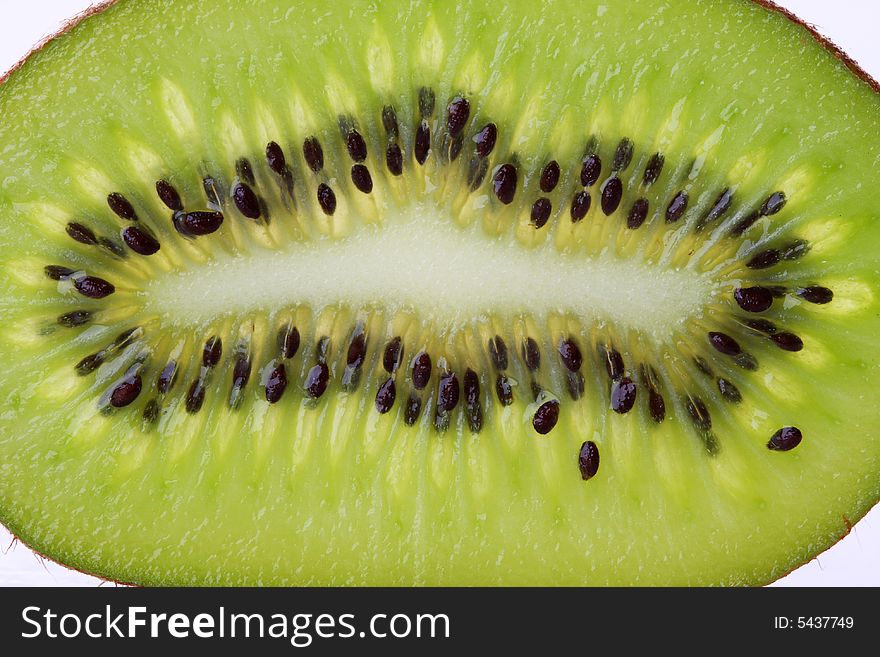 A macro shot of a backlit slice of kiwi, great detail and texture. A macro shot of a backlit slice of kiwi, great detail and texture