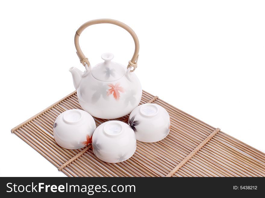 White chinese tea set on white background.